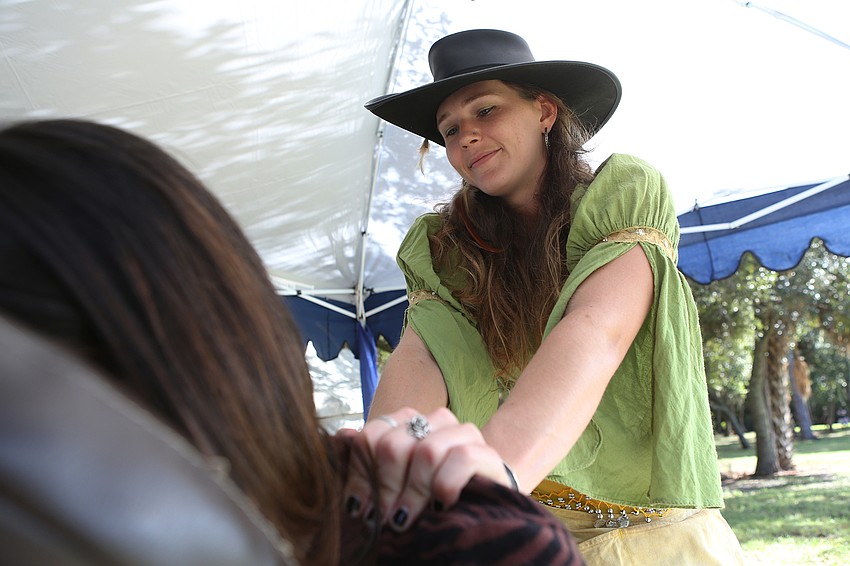 Tianna Shelley gives out massages.