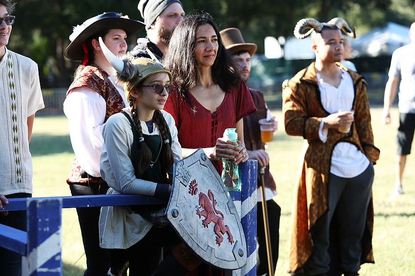 Rachel and Liz Storino watches a fencing match.