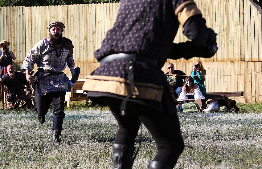 Human Combat Chess fighters really go for it at Sarasota Medieval Fair.