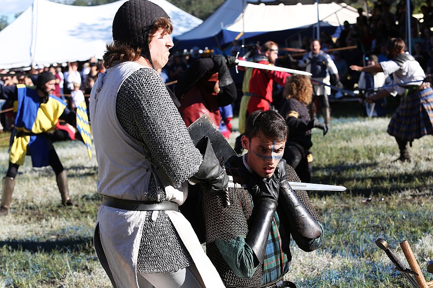Human Combat Chess  fighters really go for it at Sarasota Medieval Fair.