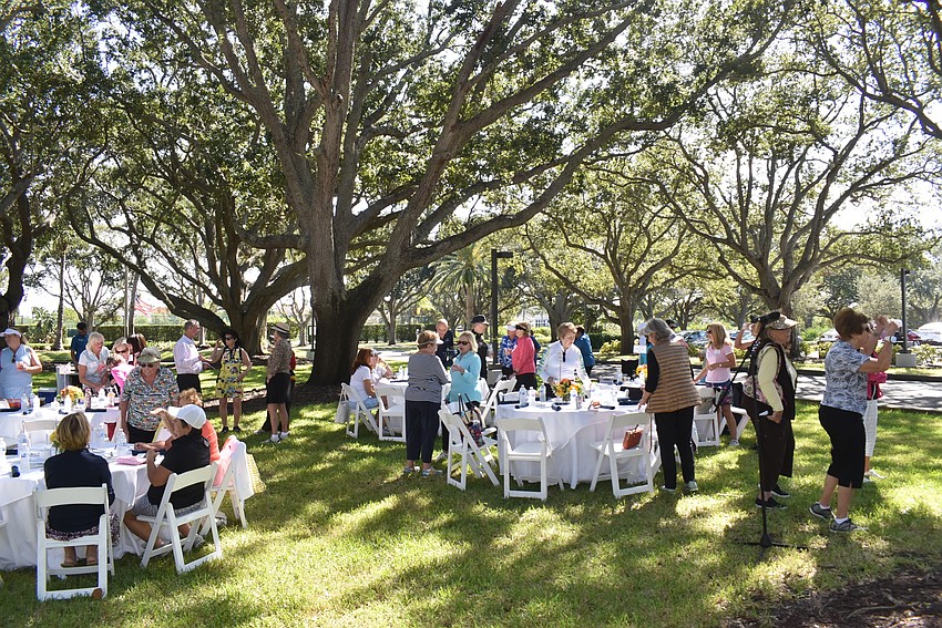 Golfers dined under the trees at the Links course.