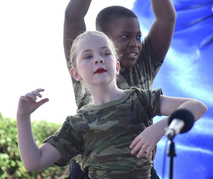 Rowlett Academy fifth grader ReAnn Kolbe  of East County puts her passion into a dance to salute veterans.