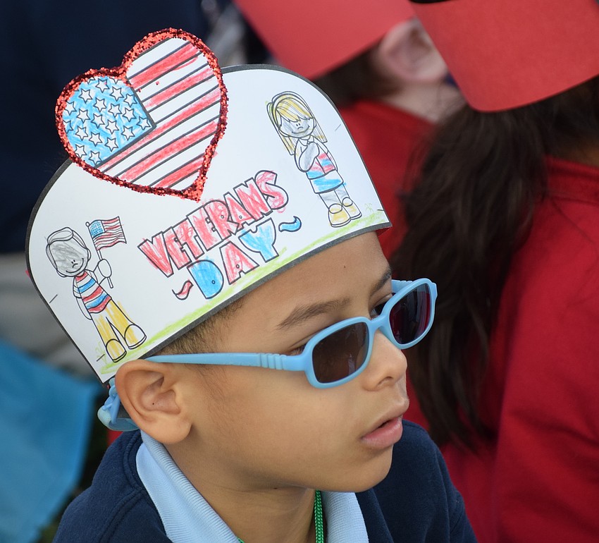 Kindergarten student Jay Dodge checks out the show after leading everyone in the Pledge of Allegiance.