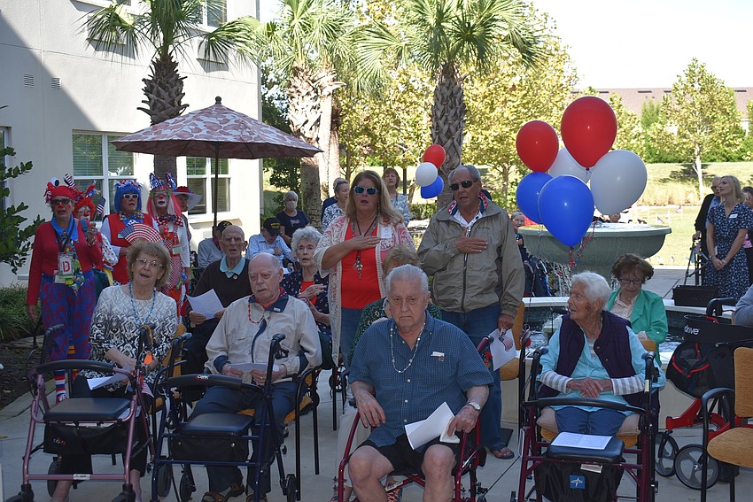 Residents of The Sheridan and their family members take in a Veterans Day ceremony November 10 in Lakewood Ranch.