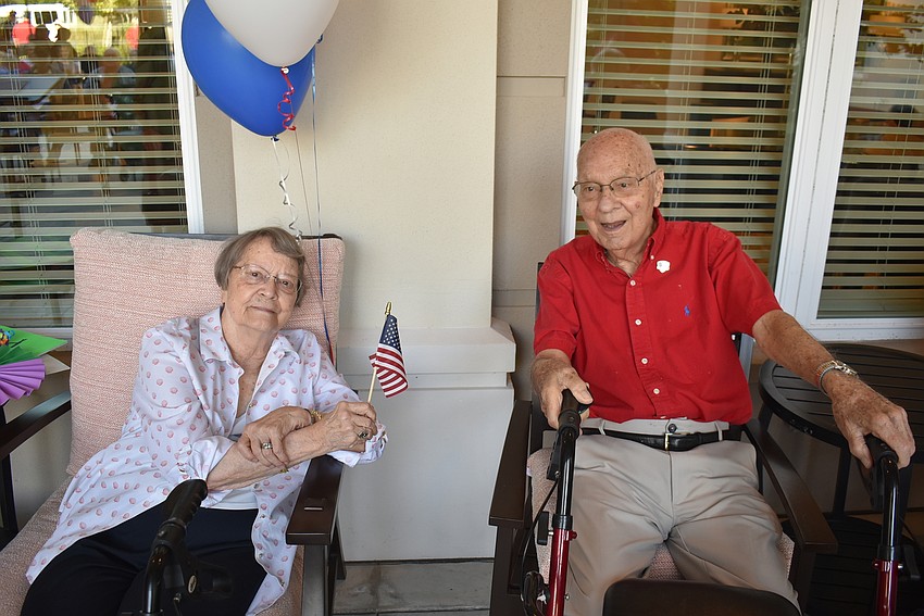 The Sheridan residents Barbara Comer and Army veteran Paul Miles enjoy the Veterans Day ceremony at The Sheridan in Lakewood Ranch.