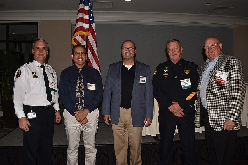 Fire chief Paul Dezzi, public works director Isaac Brownman, town manager Tom Harmer, interim police chief George Turner and Scott Gray