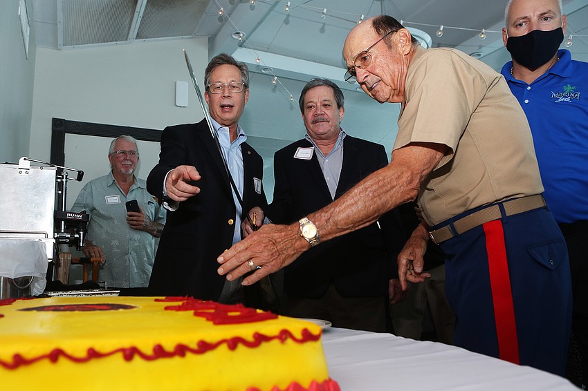 Andy and Bruce Franklin cut and pass out cake.