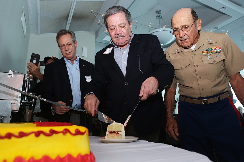 Andy and Bruce Franklin cut and pass out cake.