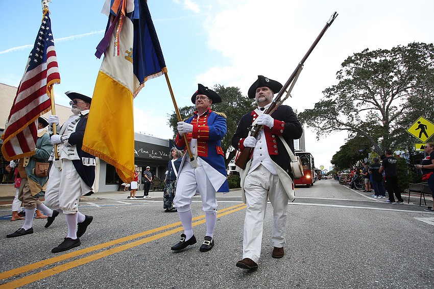 The Sons of the American Revolution group dress up for the occasion.