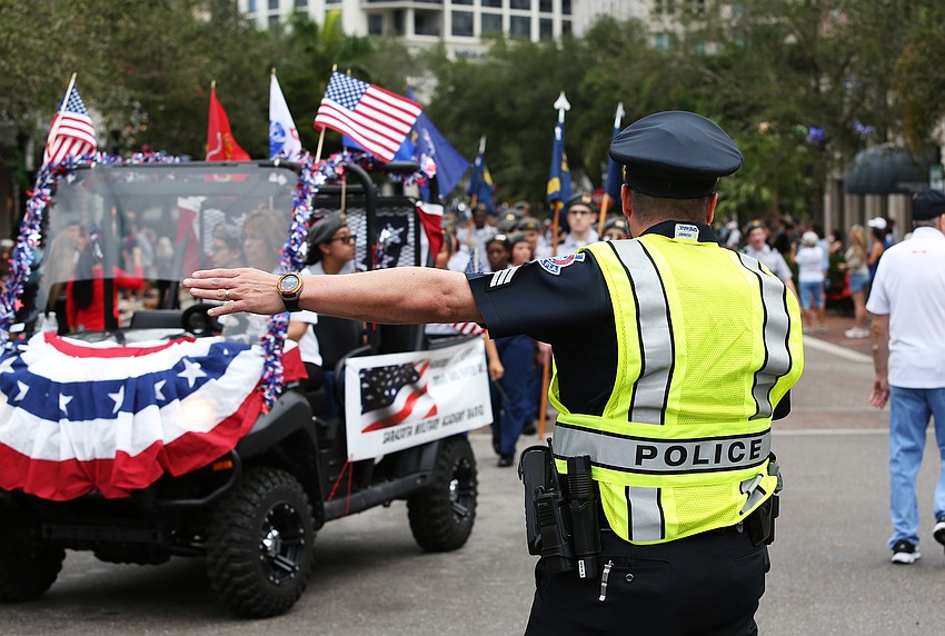 Police direct the parade where to go next.
