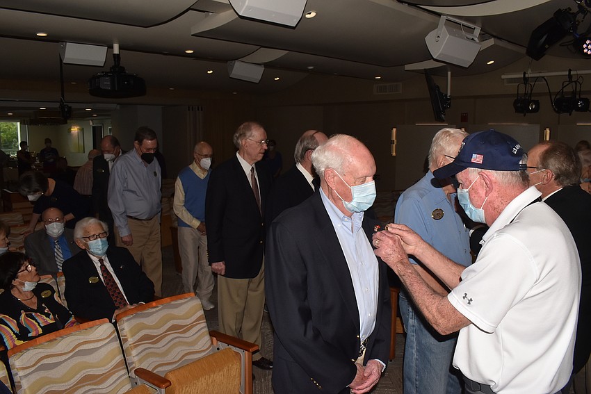 Veterans lined up to receive their pins.