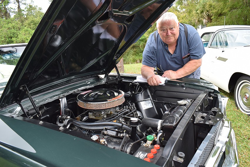 John Wishart loves the 289 high performance engine in his 1964 1/2 Mustang, the first of its kind to roll off the assembly line.