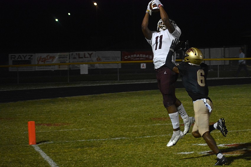 Pirates tight end Craivontae Koonce catches a touchdown pass over Countryside senior Landis Randleman.