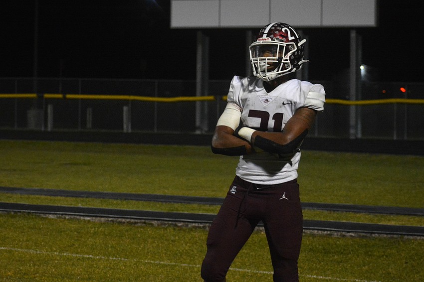 Pirates senior Nehemiah Jenkins celebrates after a rushing touchdown.