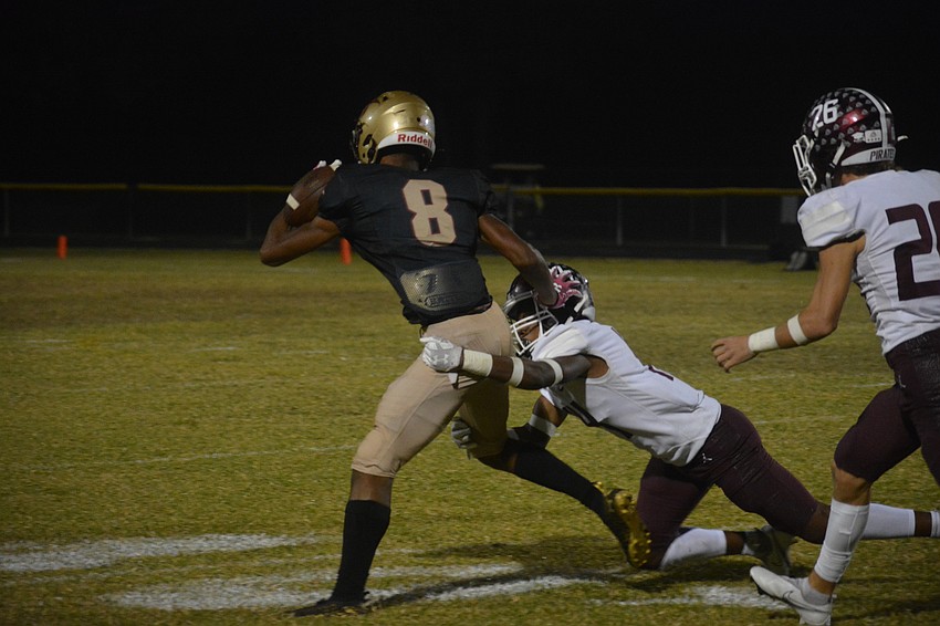 Pirates sophomore Jamaris Rutledge tackles Countryside junior Terrence Jackson.