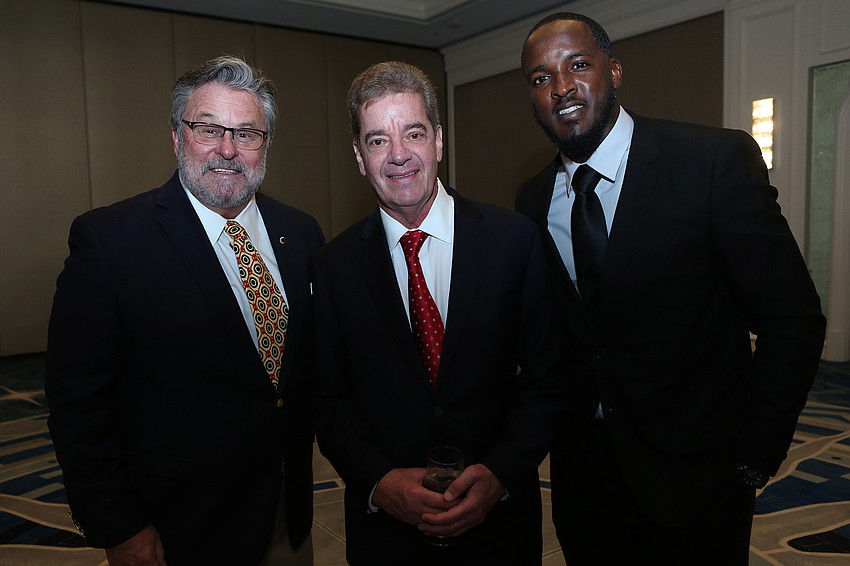 Richard Karp, president and CEO Jeffrey Peterson and Vernon Kearney