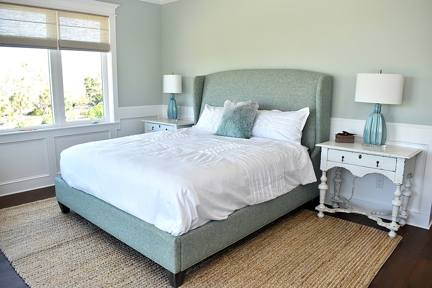 Each of the bedrooms have blue accents and exude a coastal theme.