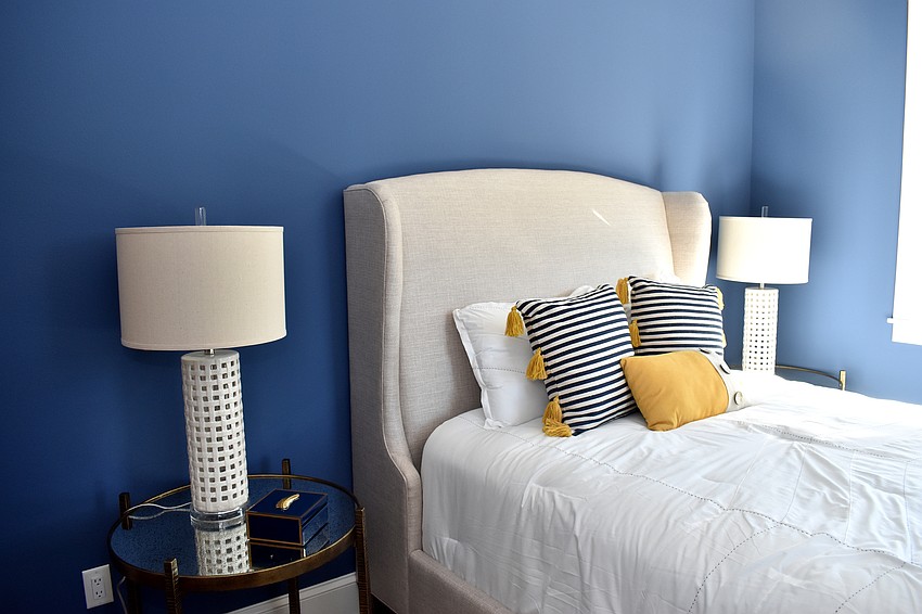Each of the bedrooms have blue accents and exude a coastal theme.
