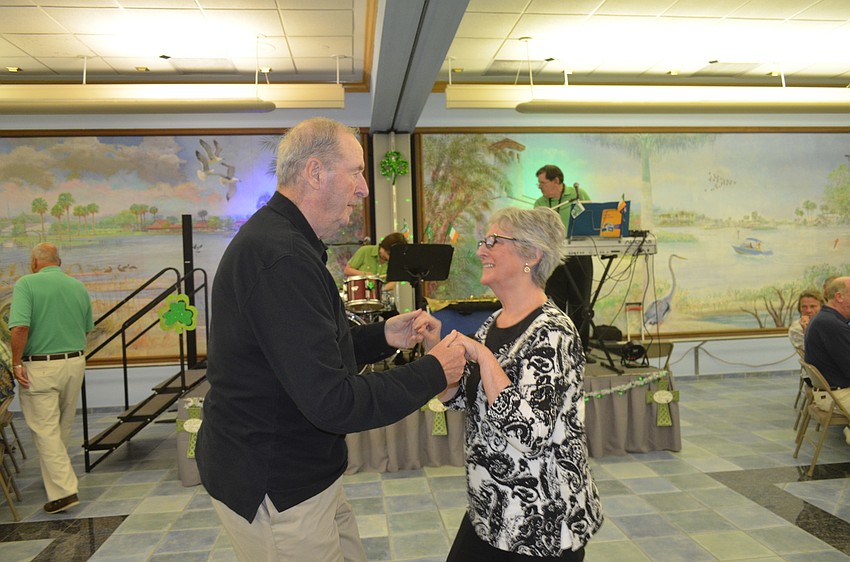 Ann Marie Dickson and her brother, John Joyce, dance.