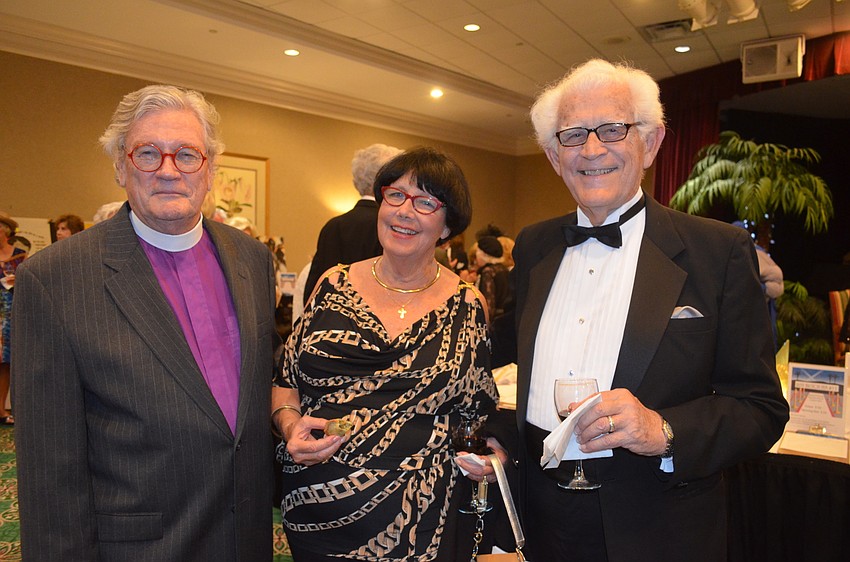 The Rev. Vincent Carroll, of Longboat Island Chapel, Winnie Downes and Carl Denney