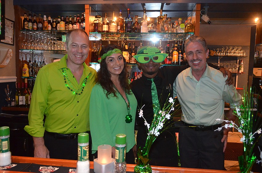General Manager Erick Flanagan, bartenders Courtney Rossle and Andrew Tolbert and owner Michael Garey