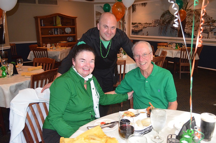 Julie Hall, server Travis Peterson and Ron Hall