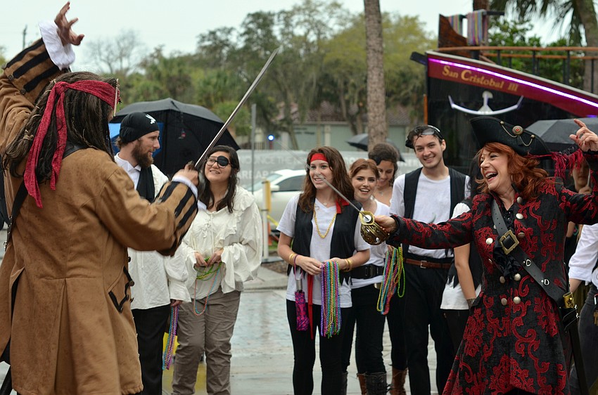 Dr. Larry and Pat Thompson engage in a pirate sword fight upon arriving at 'Bringing the Characters to Life.'
