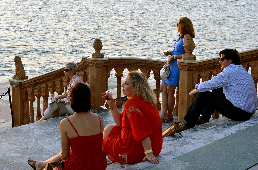 Guests enjoyed the sunset from the bayfront terrace at Wine Walk to Ca’ d’Zan.