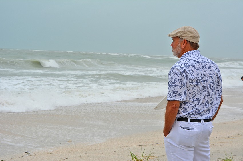 Beachgoers flock to Lido Beach to watch surfers.
