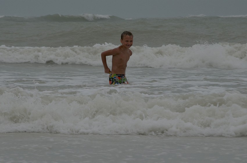 Connor Geistwhite, 6, plays in the high waves as Tropical Storm Hermine makes its way toward Florida. Connor and his parents, Heather and Ryan Geistwhite, are visiting from Illinois. “We needed to get a little bit of waves in,