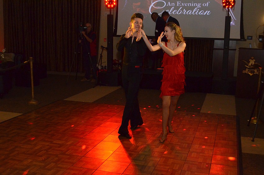 Performers from Dynasty Dance Clubs give attendees a taste of the moves they were to learn later in the evening.