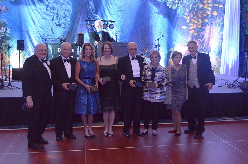 Jim Ericson, Maurice Cunniffe, Elizabeth Moore, Anne Essner, Bob Essner, Carolyn Cunniffe, Nancy Moskovitz and Dr. Rick Moskovitz pose after receiving a shark tooth gift for their generous donations of $1 million or more to the campaign.