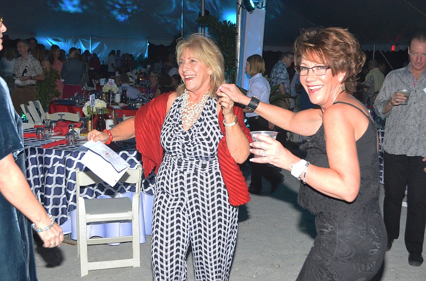 Children First Vice President of Development Carol Butera dances with Rosemary Eure.