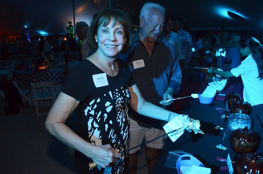 Joanne Powers shows off her s’more at the dessert station. Powers made a chocolate and bacon s’more.