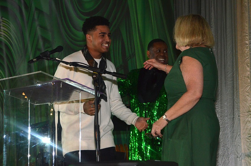 Christopher Eisenberg goes to embrace Westcoast Black Theatre Troupe Executive Director Julie Leach.