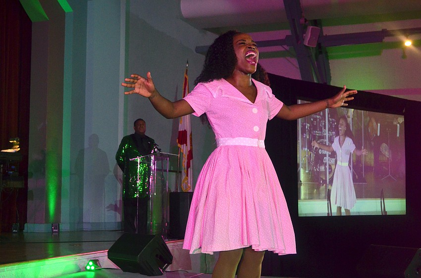Khadijah Rolle performs as Dorothy during an excerpt of “The Wiz” performed for Emerald City Ball guests.