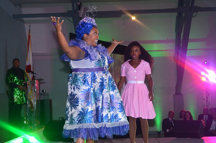 Ariel Blue performs as Addaperle alongside Khadijah Rolle during an excerpt of “The Wiz” performed for Emerald City Ball guests.