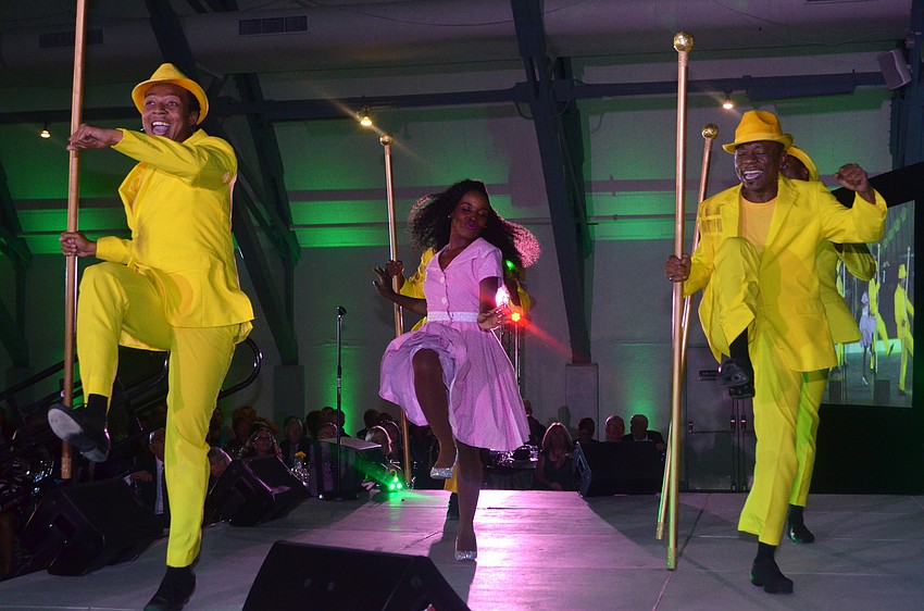 Khadijah Rolle performs as Dorothy with the members of the “Yellow Brick Road” during an excerpt of “The Wiz” performed for Emerald City Ball guests.
