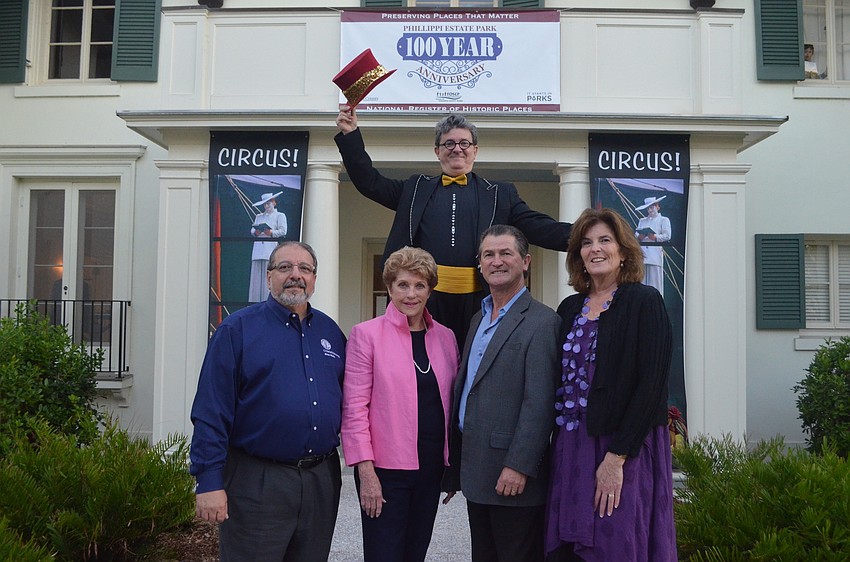Commissioner Alan Maio, Priscilla Brown, Founder of Circus Sarasota Pedro Reis and Elizabeth Siegfried with stilt walker Aaron Watkins of Circus Sarasota