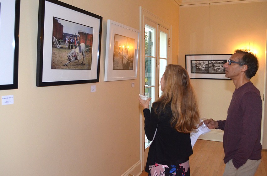 Steve and Nancy Norris admire the photos in the exhibit.