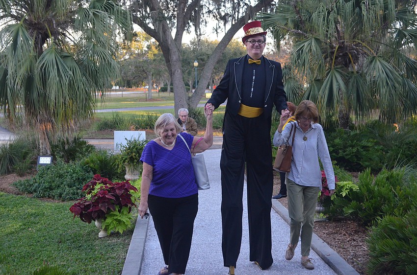 Aaron Watkins of Circus Sarasota leads guests to the entrance of the mansion.