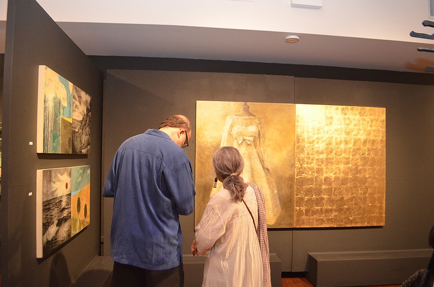 Guests admire the artwork by Jack King and Will Corr.