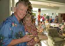 Harry and Mary Jo Steltmann host the Palm Aire Women' s Club Holly Jolly event on Dec. 4 at their home.