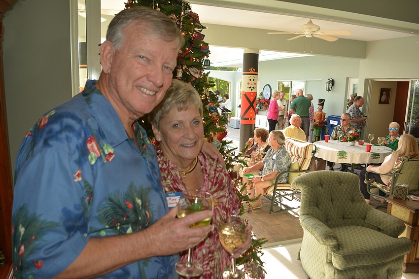 Harry and Mary Jo Steltmann host the Palm Aire Women' s Club Holly Jolly event on Dec. 4 at their home.