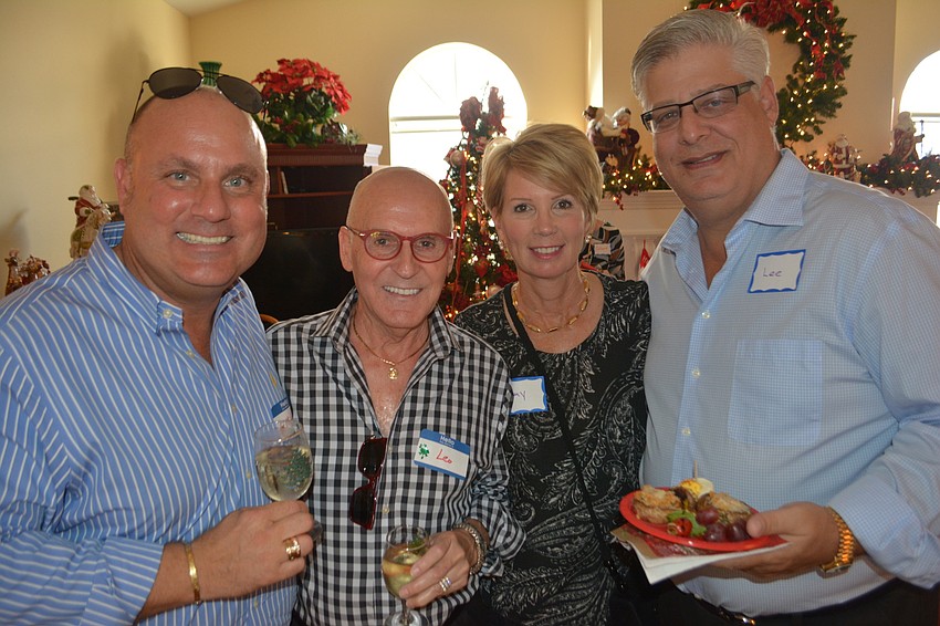 Michael and Leo LaPlante and Amy and Lee Amberg support the Holly Jolly fundraiser.
