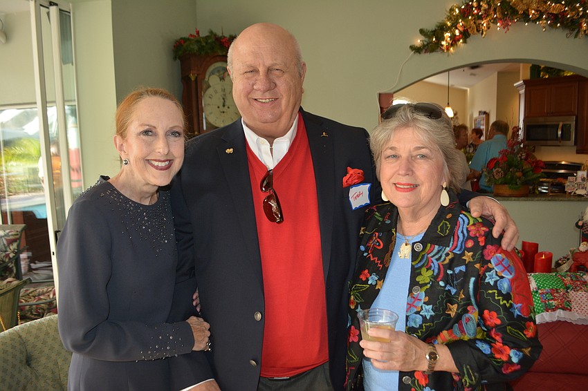 Susan and Terry Romine and Sherry Coles enjoy the Holly Jolly.
