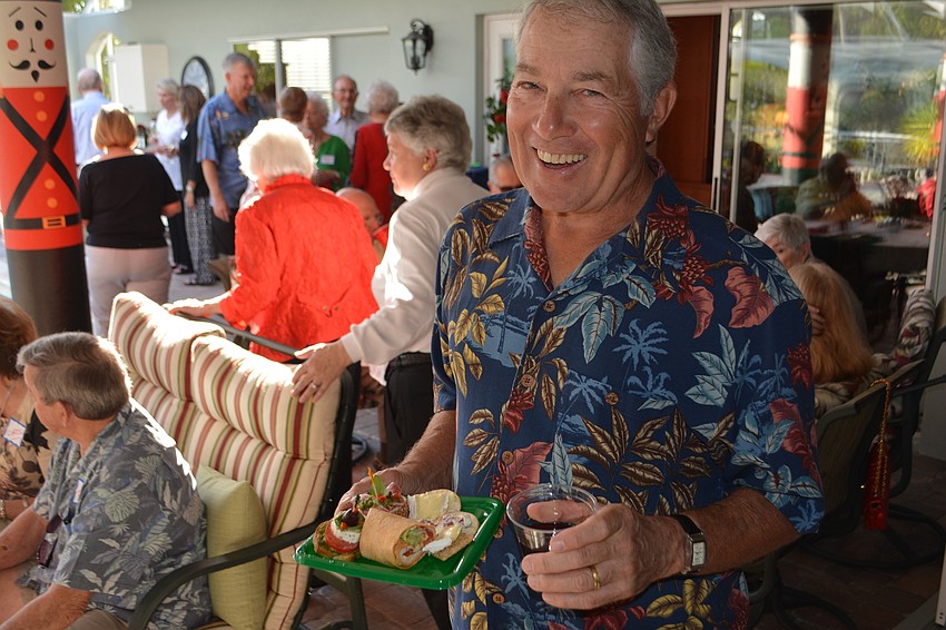 Jim Introne is smiling after coming away from the food line.