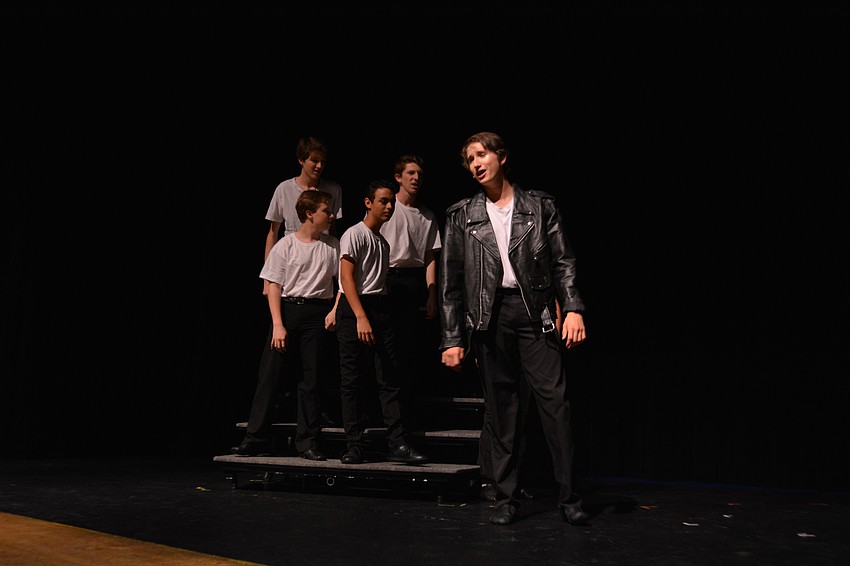 Ty Dearing, as Danny, sings about his summer love, a girl named Sandy, during 