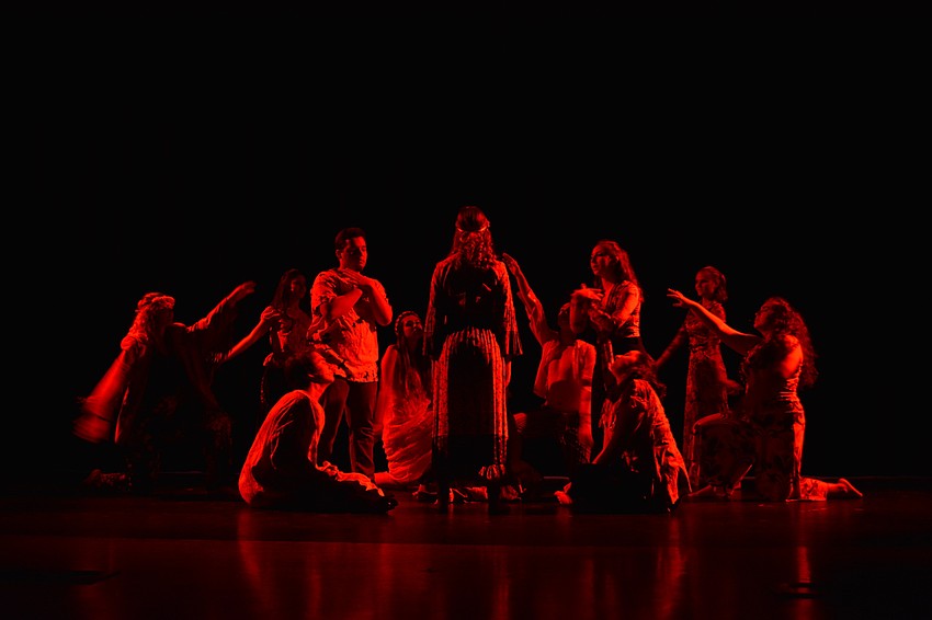 A dimly lit stage started off the song 