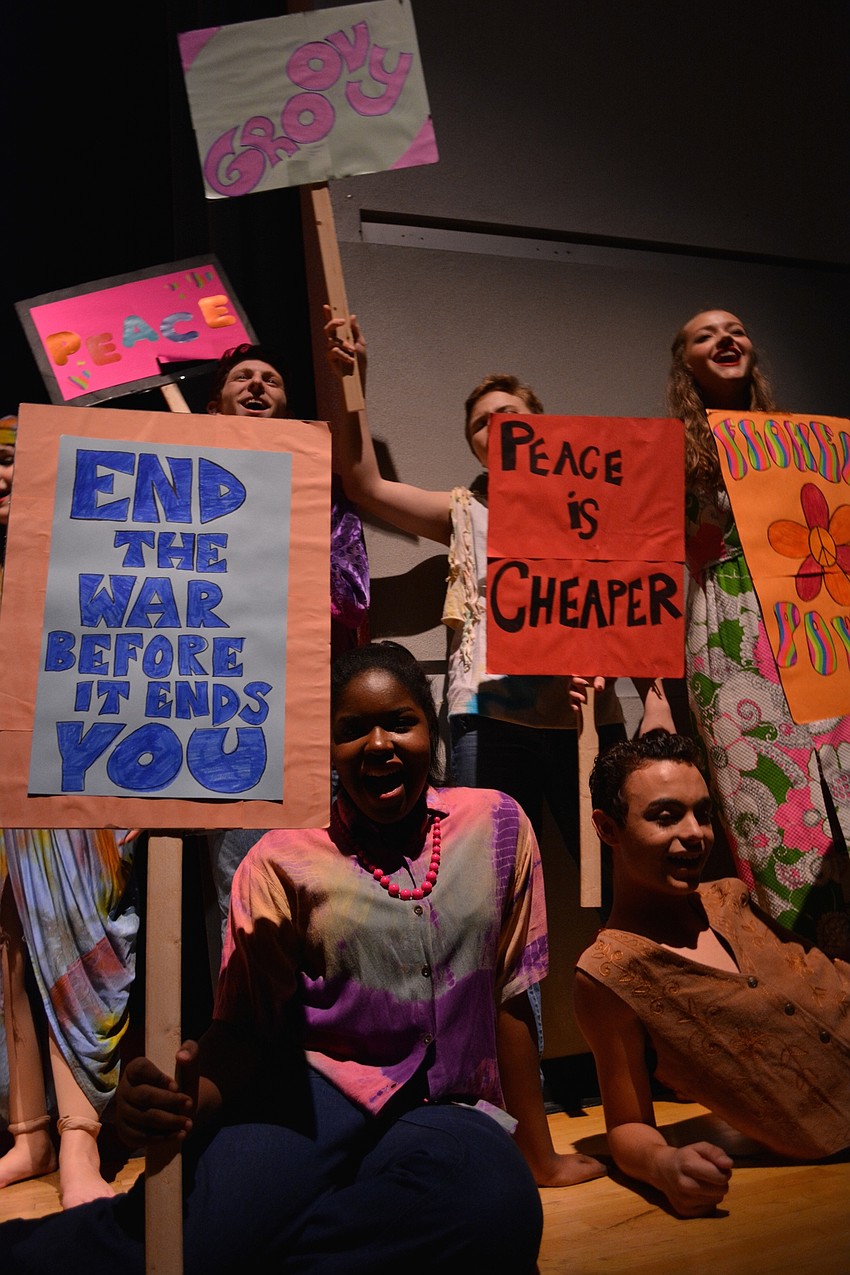 Protesters promote peace in a scene from 